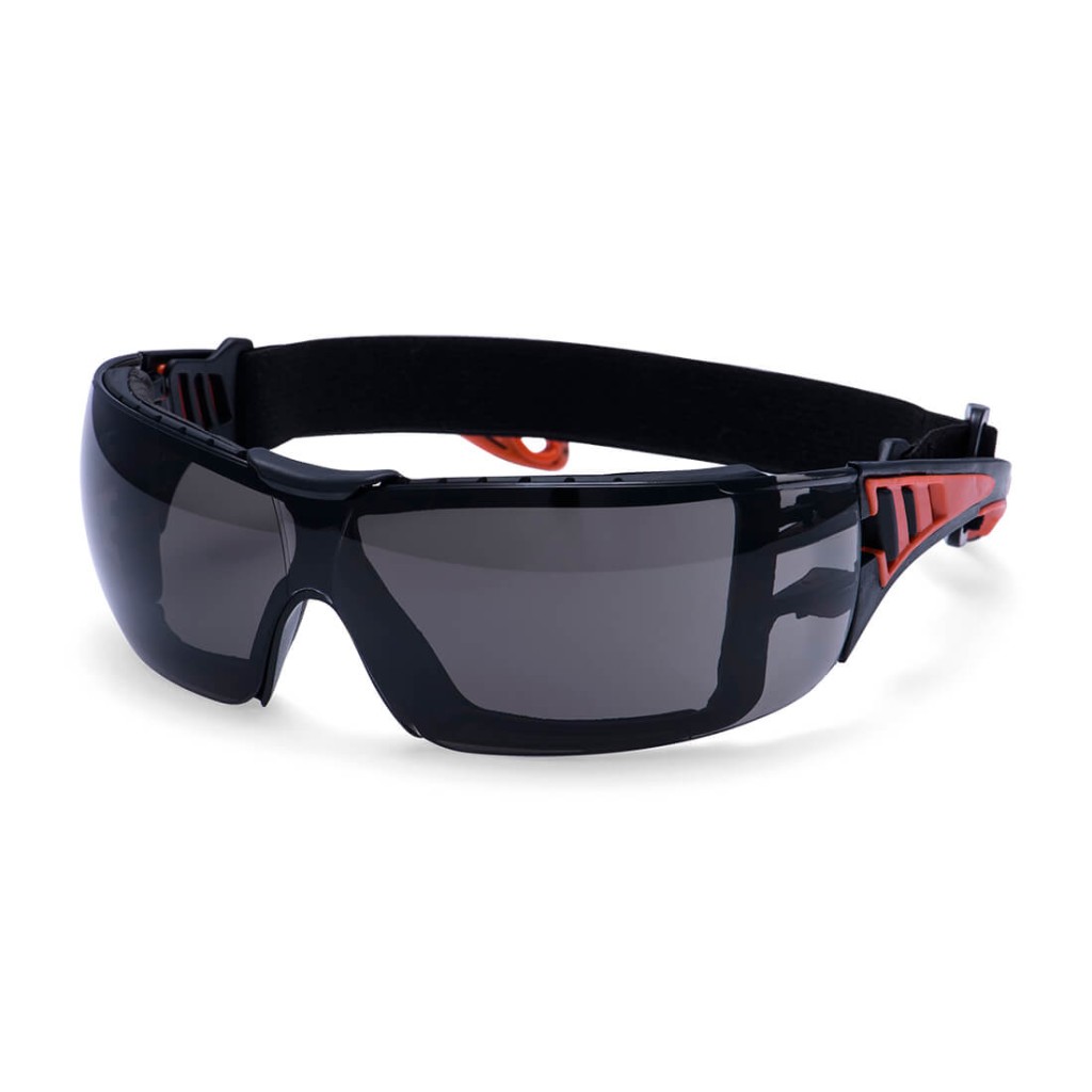 A pair of safety spectacles with clear impact-resistant lenses and adjustable side arms, for eye protection during site work.