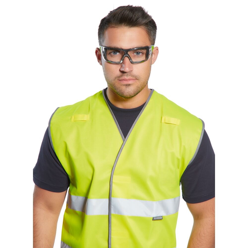 A pair of safety spectacles with clear impact-resistant lenses and adjustable side arms, for eye protection during site work.