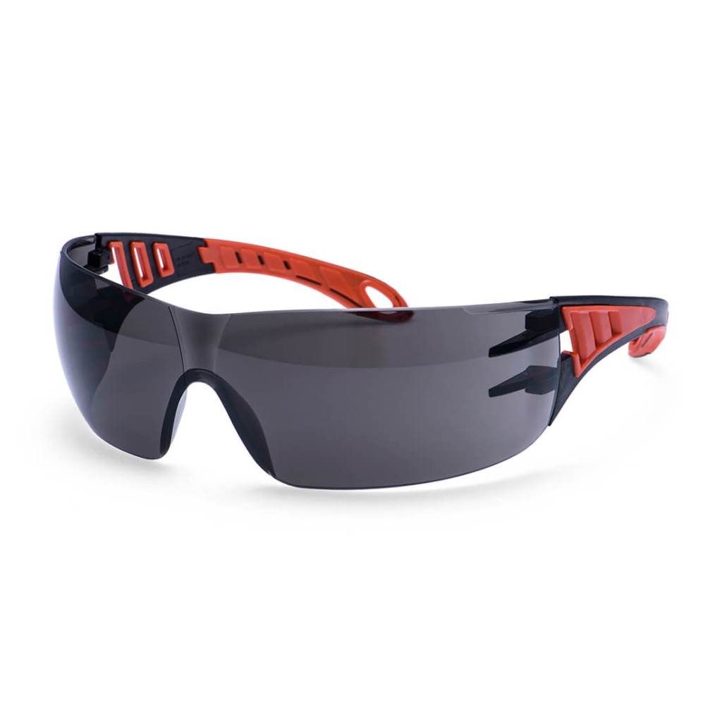A pair of safety spectacles with clear impact-resistant lenses and adjustable side arms, for eye protection during site work.