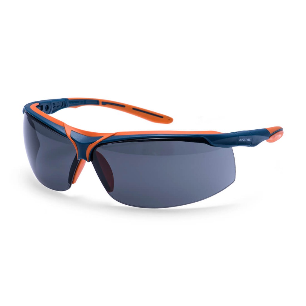 A pair of safety spectacles with clear impact-resistant lenses and adjustable side arms, for eye protection during site work.