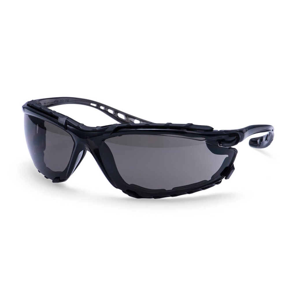 A pair of safety spectacles with clear impact-resistant lenses and adjustable side arms, for eye protection during site work.