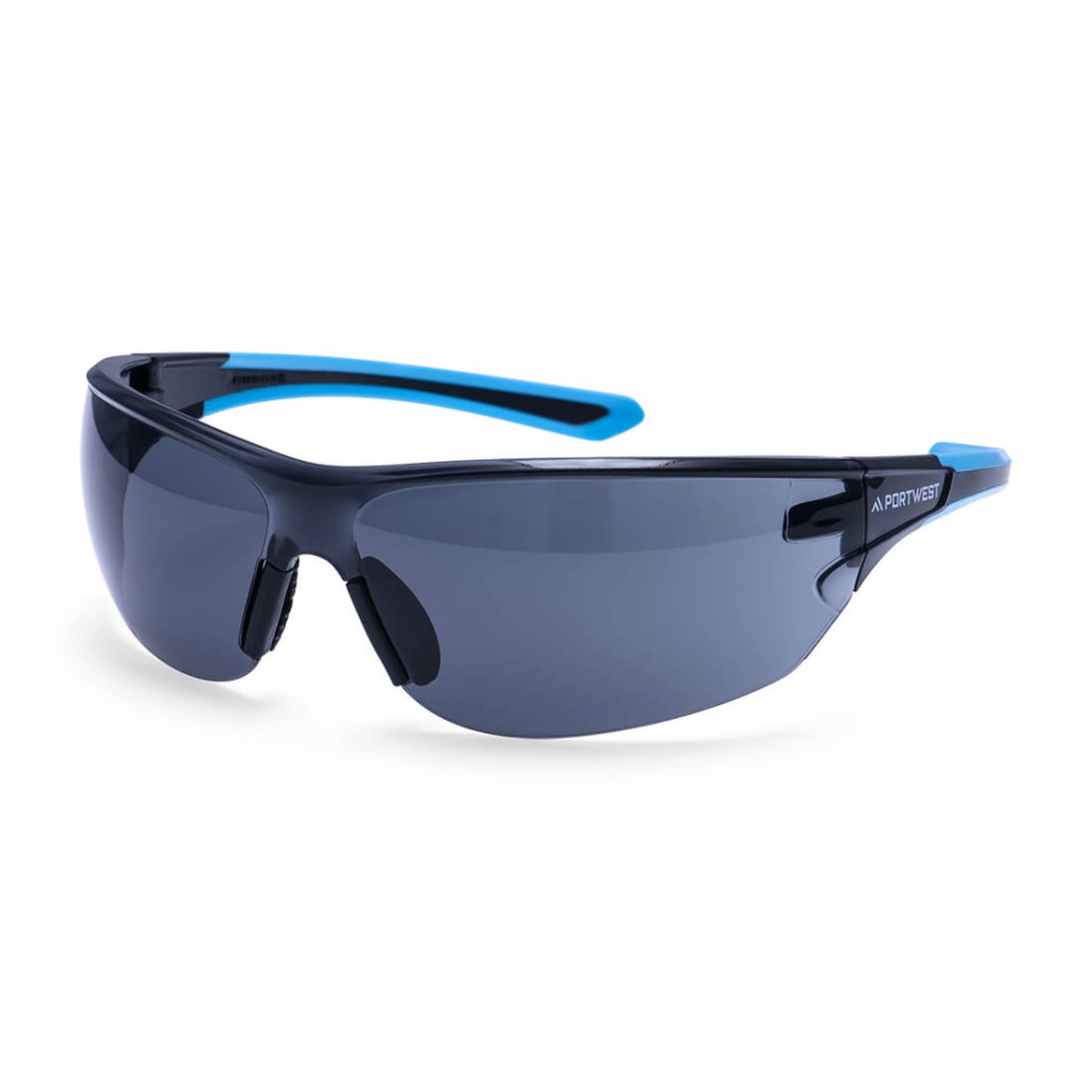 A pair of safety spectacles with clear impact-resistant lenses and adjustable side arms, for eye protection during site work.