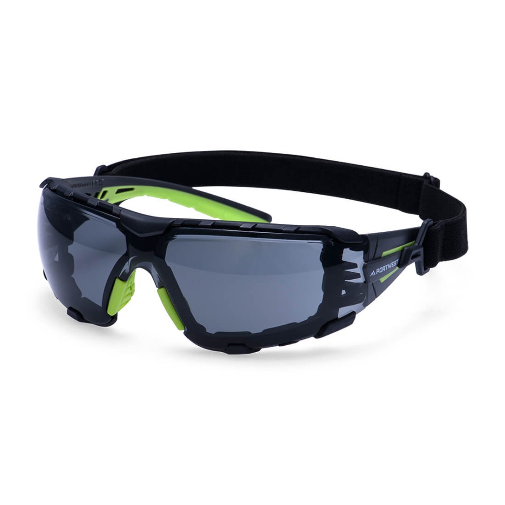A pair of safety spectacles with clear impact-resistant lenses and adjustable side arms, for eye protection during site work.