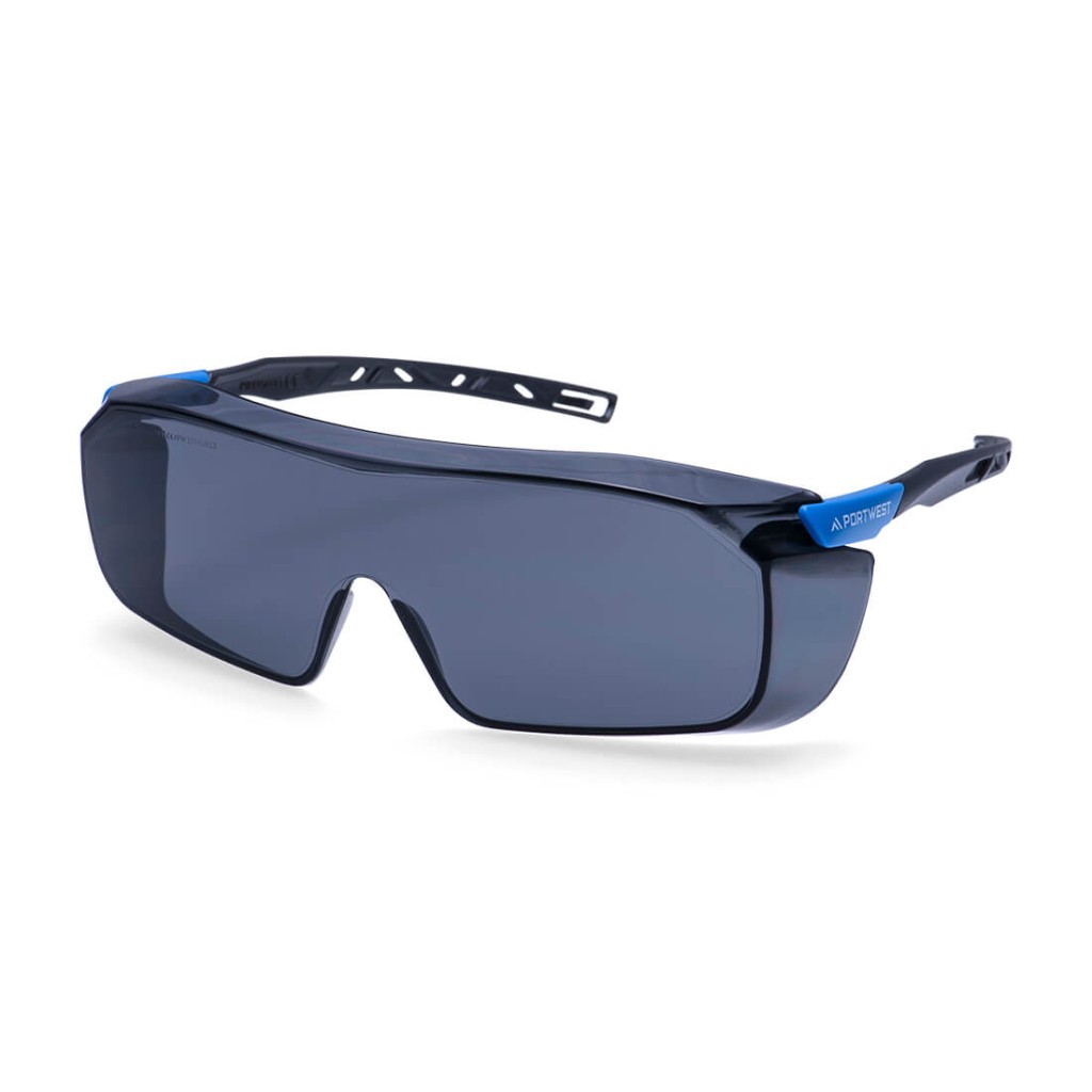 A pair of safety spectacles with clear impact-resistant lenses and adjustable side arms, for eye protection during site work.