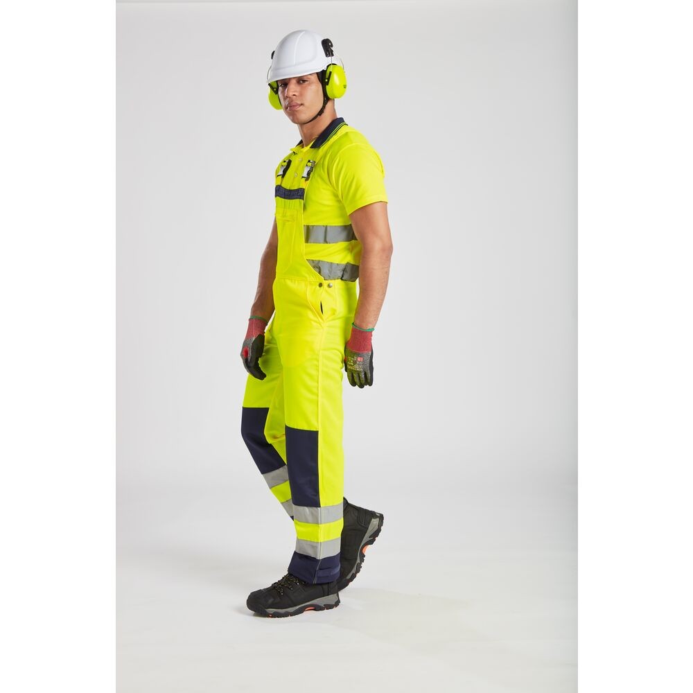 A white safety helmet with an adjustable suspension harness and ventilation slots, providing impact protection on construction sites.
