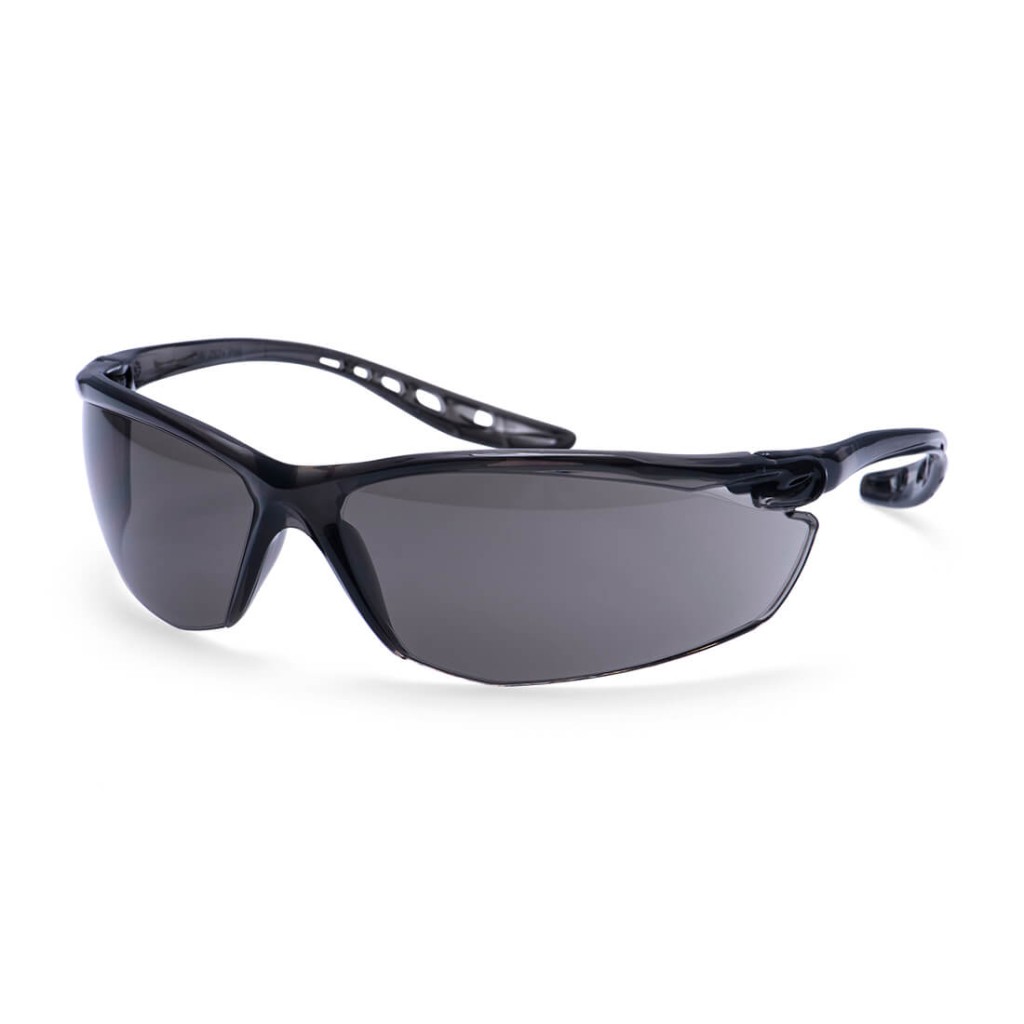 A pair of safety spectacles with clear impact-resistant lenses and adjustable side arms, for eye protection during site work.