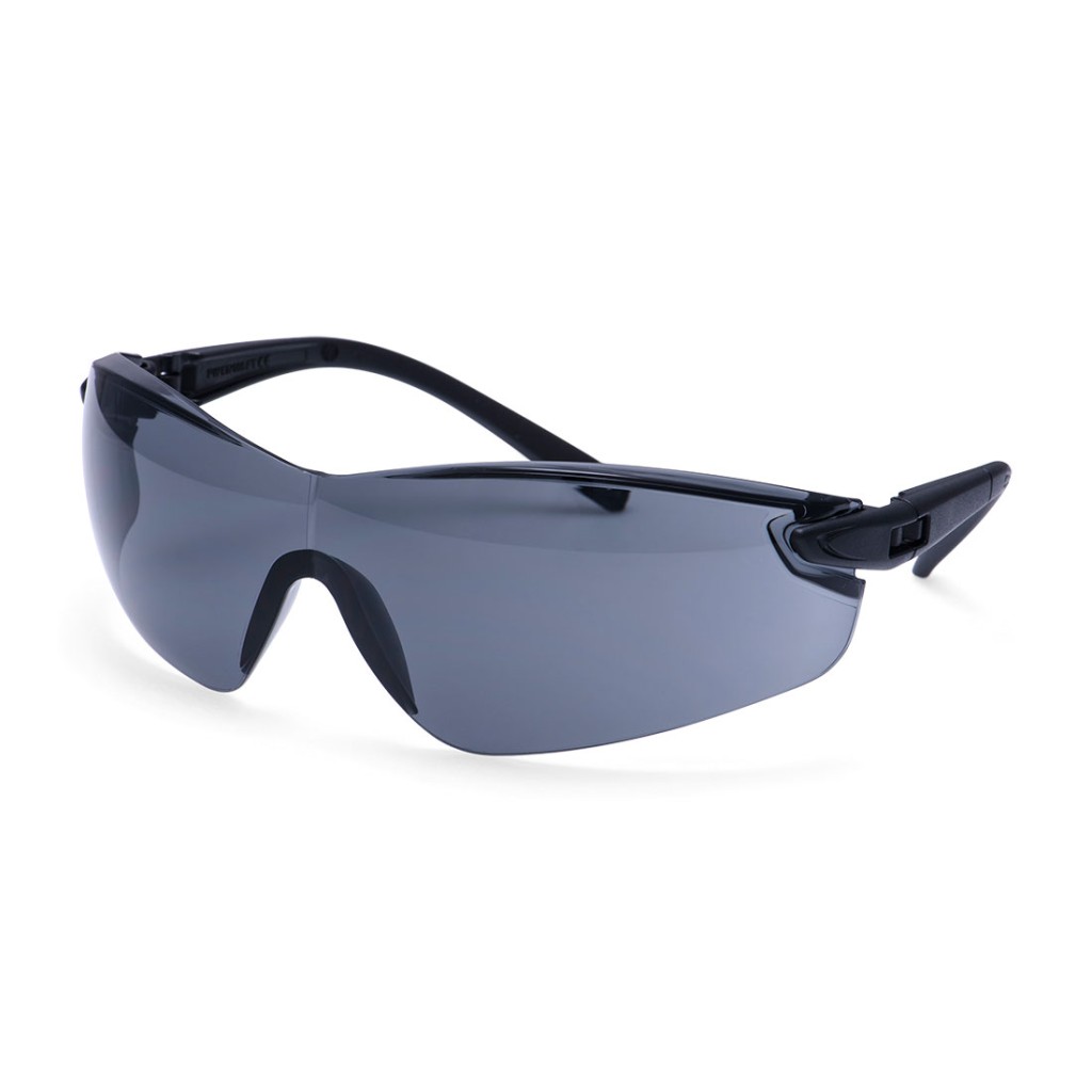 A pair of safety spectacles with clear impact-resistant lenses and adjustable side arms, for eye protection during site work.