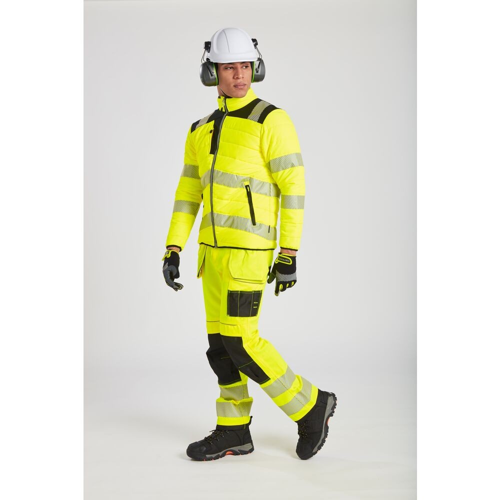 A high-visibility yellow jacket featuring retroreflective tape panels, suitable for a wide range of outdoor and site work applications.