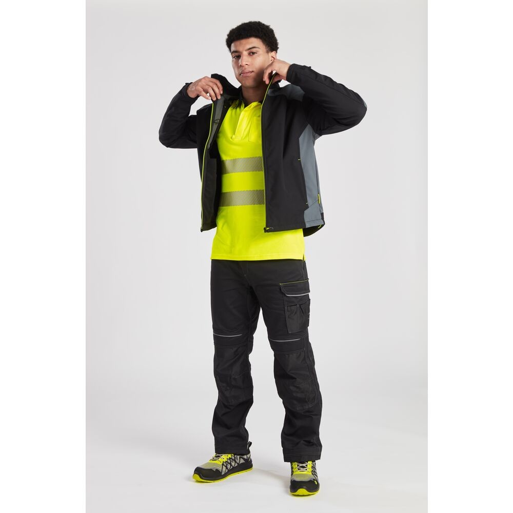 A black softshell jacket designed for use on construction sites and in industrial work environments.,