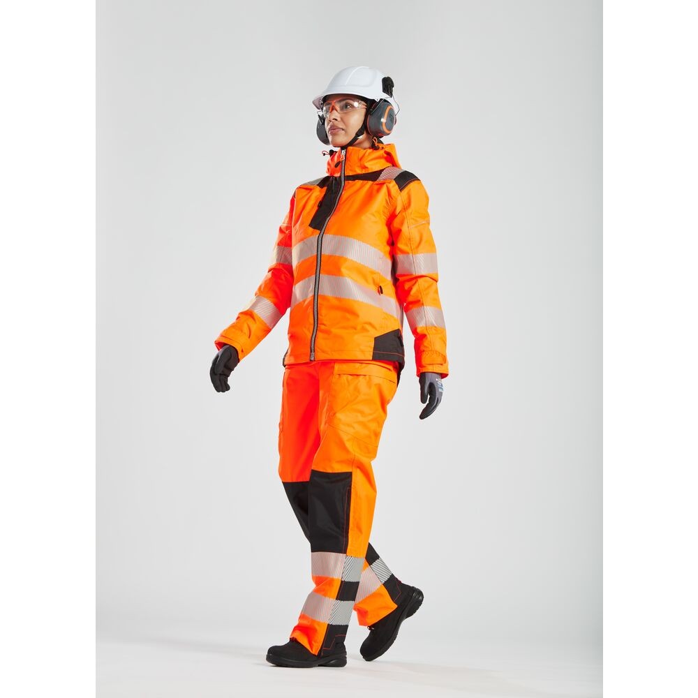 A women's high-visibility orange jacket featuring retroreflective tape panels, suitable for a wide range of outdoor and site work applications.