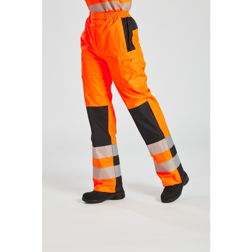 A pair of women's high-visibility orange trousers featuring retroreflective tape panels, suitable for a wide range of outdoor and site work applications.
