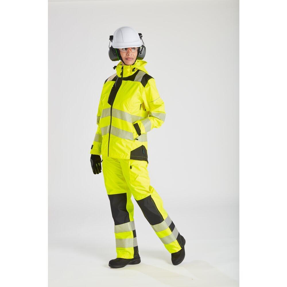 A pair of women's high-visibility yellow trousers featuring retroreflective tape panels, suitable for a wide range of outdoor and site work applications.