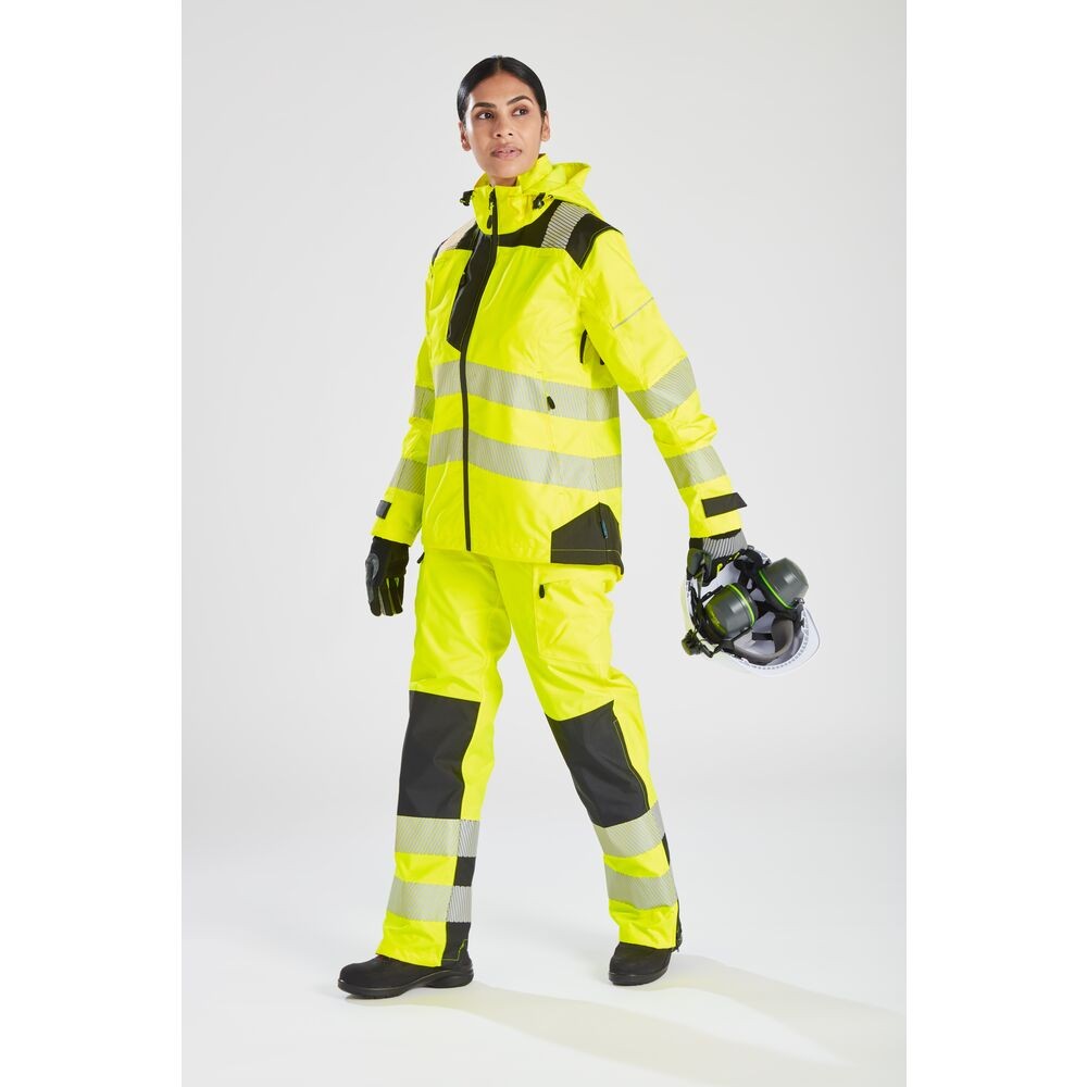 A pair of women's high-visibility yellow trousers featuring retroreflective tape panels, suitable for a wide range of outdoor and site work applications.