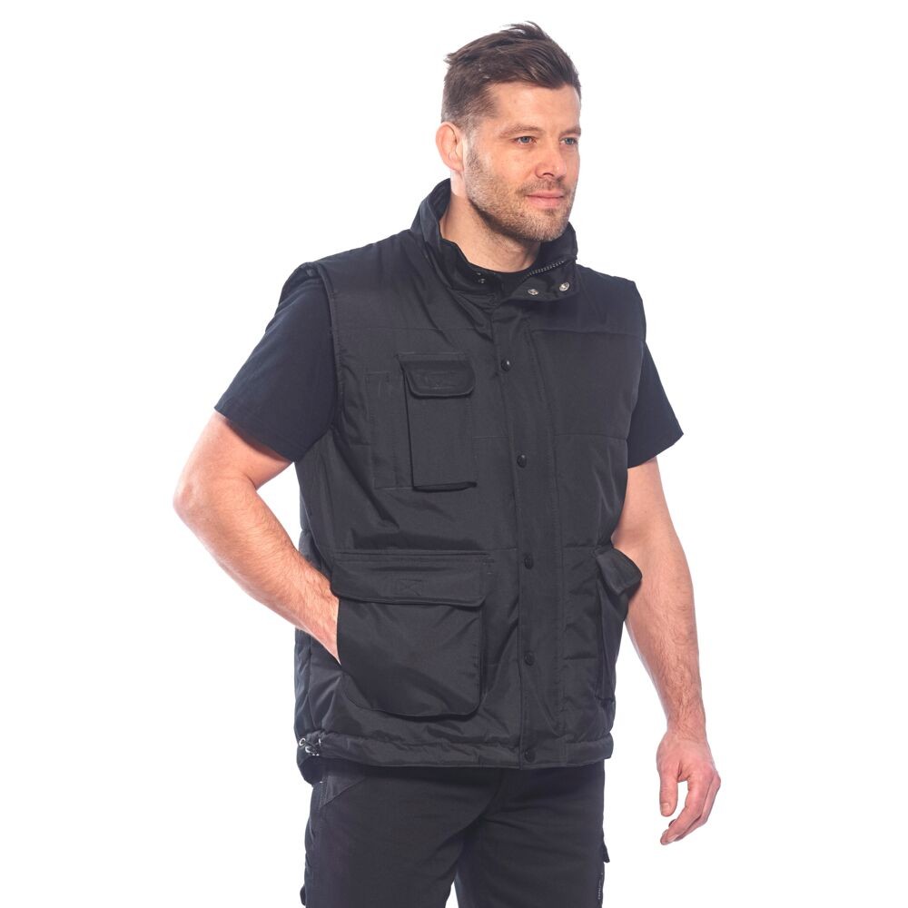 A black workwear garment designed for use on construction sites and in industrial work environments.,