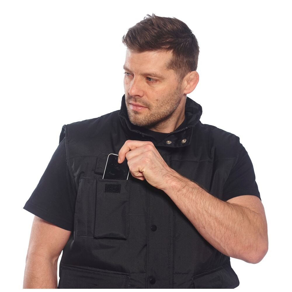 A black workwear garment designed for use on construction sites and in industrial work environments.,
