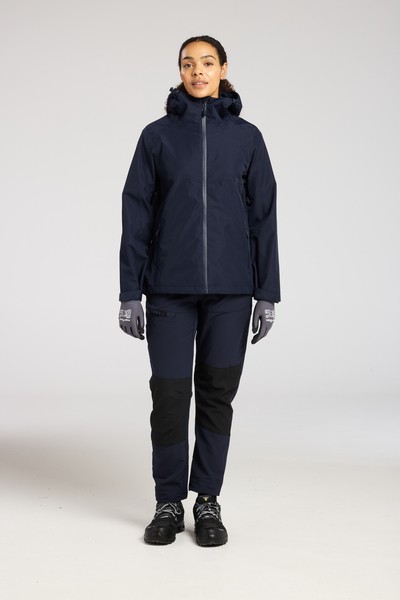 A women's navy blue waterproof jacket designed for use on construction sites and in industrial work environments.,