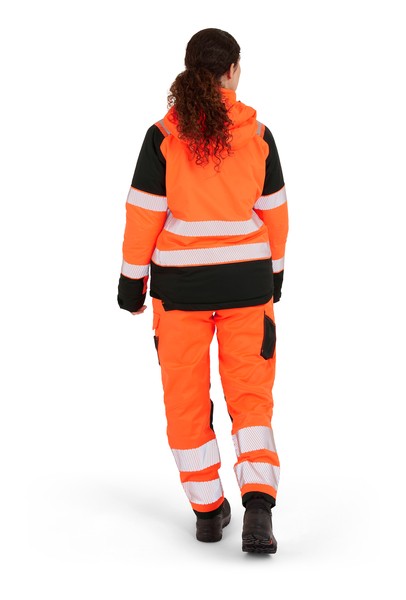 A women's high-visibility orange jacket featuring retroreflective tape panels, suitable for a wide range of outdoor and site work applications.