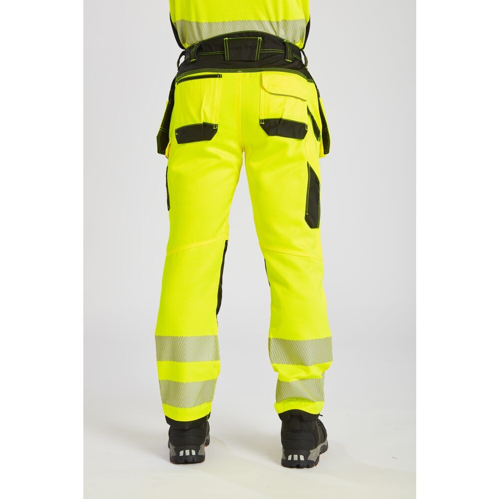 A pair of high-visibility yellow trousers featuring retroreflective tape panels, functional pockets, suitable for a wide range of outdoor and site work applications.