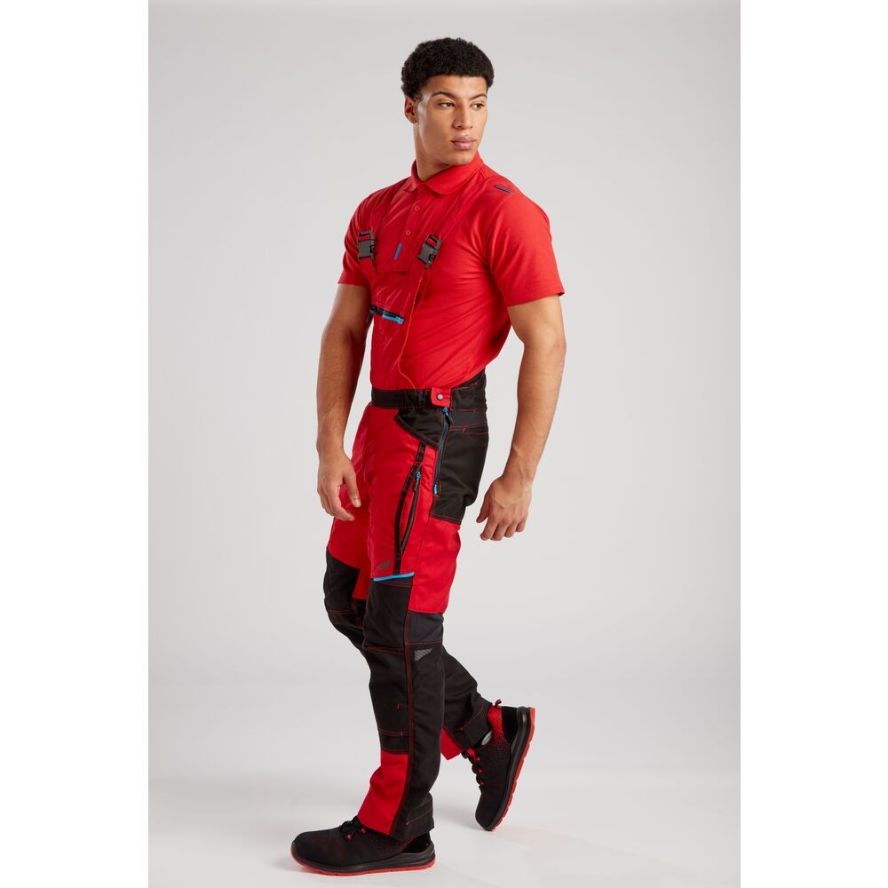 A red workwear garment designed for use on construction sites and in industrial work environments.,