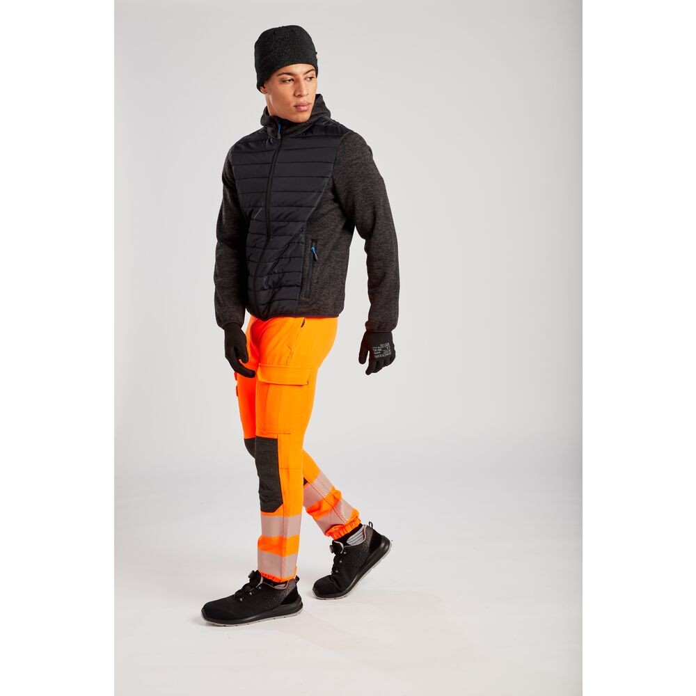 A grey jacket designed for use on construction sites and in industrial work environments.,