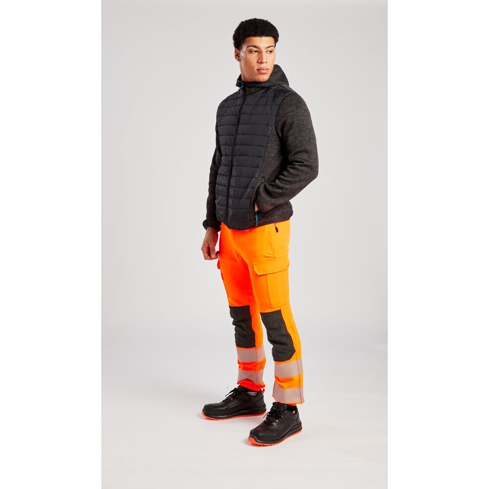 A grey jacket designed for use on construction sites and in industrial work environments.,