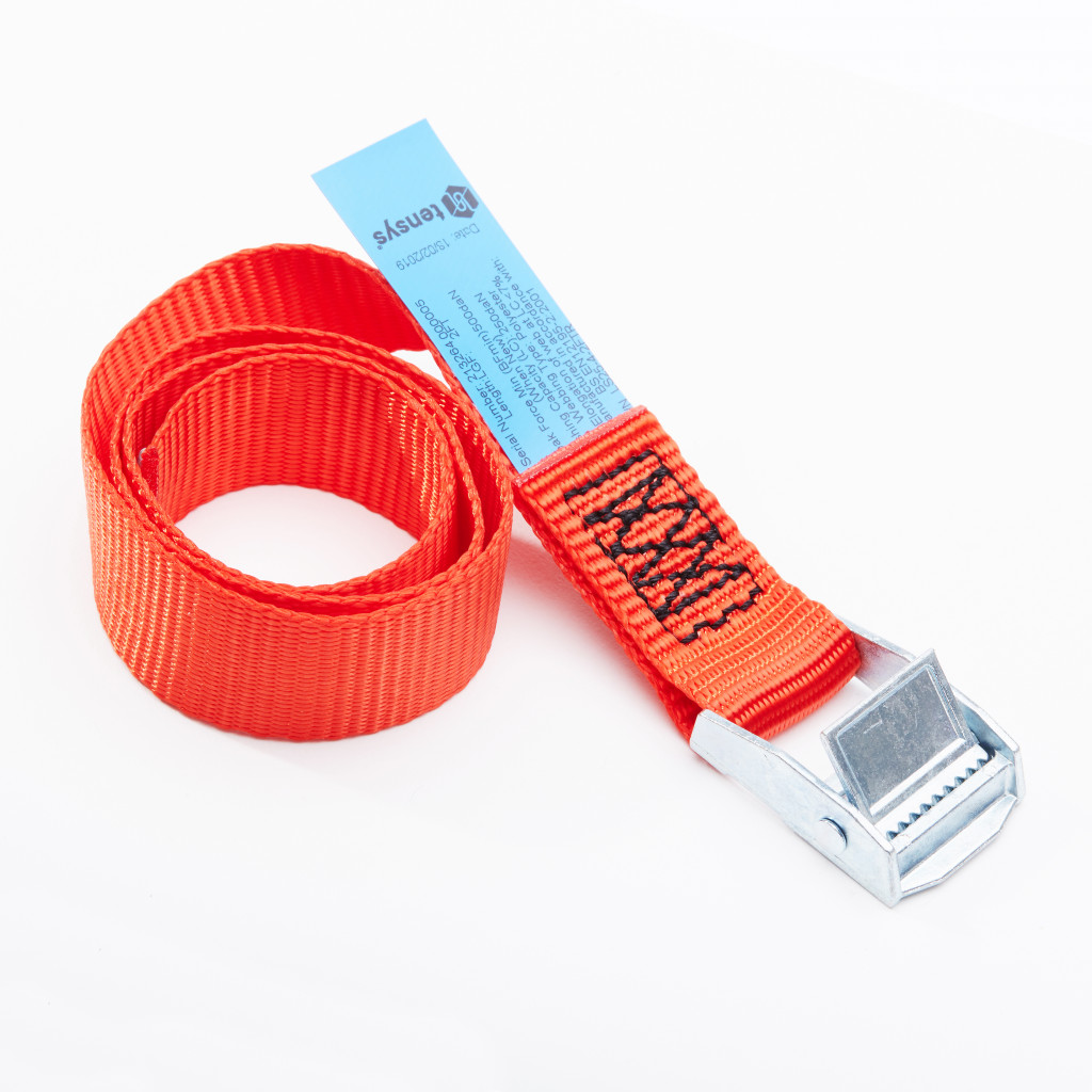 A coiled orange tie-down strap with a metal cam buckle and a blue label attached, displayed on a white background.