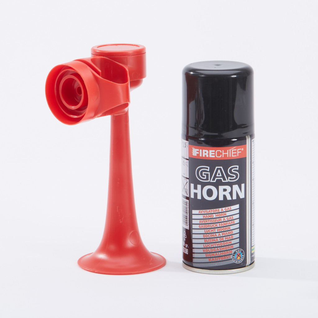A red plastic air horn with a separate black canister labeled FIRECHIEF GAS HORN is displayed against a plain white background.,