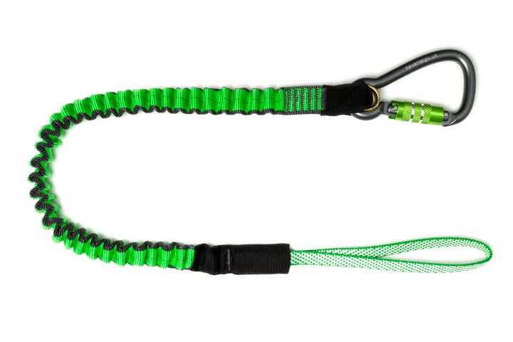 A green and black coiled safety lanyard with a loop at one end and a black carabiner with a locking mechanism at the other end, displayed on a white background.