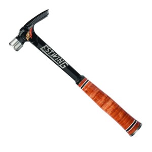 A framing hammer with a waffle-textured steel head, a straight rip claw, and a long steel-handled handle, designed for heavy-duty structural carpentry.