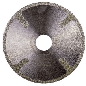 A circular metal object with a hole in the middle.,