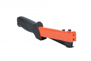 A red and black hand-held staple gun with a rubberized grip handle, designed for heavy-duty stapling tasks. The device is angled and shown against a white background.