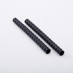 Two black, ridged, cylindrical rods are placed parallel to each other on a white surface.