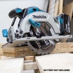 A teal and black Makita cordless circular saw with a 18V motor, an adjustable bevel plate, and a blade guard, for ripping and cross-cutting timber.