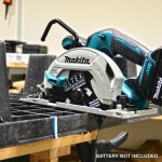 A teal and black Makita cordless circular saw with a 18V motor, an adjustable bevel plate, and a blade guard, for ripping and cross-cutting timber.