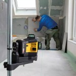 A Stabila self-levelling laser level projecting horizontal and vertical lines, for precision alignment and setting-out work.