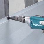 A teal and black Makita corded power tool, 110V, with an ergonomic grip, designed for use on construction and maintenance tasks.