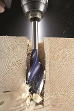 A wood drill bit with a precision-ground tip and fluted shank, for drilling into timber and sheet wood.