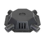 A black, hexagonal plastic device with six cylindrical openings and vent-like slits on two sides, seen from above on a white background.