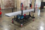 A steel metal shelving unit with adjustable shelf heights and a robust welded steel frame, for organised storage in workshops and site cabins.