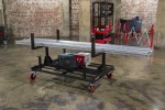 A steel metal shelving unit with adjustable shelf heights and a robust welded steel frame, for organised storage in workshops and site cabins.