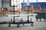 A steel metal shelving unit with adjustable shelf heights and a robust welded steel frame, for organised storage in workshops and site cabins.