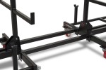 A steel metal shelving unit with adjustable shelf heights and a robust welded steel frame, for organised storage in workshops and site cabins.