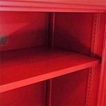 A steel metal shelving unit with adjustable shelf heights and a robust welded steel frame, for organised storage in workshops and site cabins.