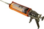 An orange and black Spit cordless power tool, with an ergonomic grip, designed for use on construction and maintenance tasks.