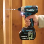 A teal and black Makita cordless impact driver with a 18V motor, a hex-chuck, and variable speed, for high-torque screw driving and fastening.