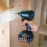A teal and black Makita cordless combi drill with an 18V motor, a 13mm keyless chuck, and hammer, drill, and screwdriver modes.
