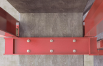 A metal M12 through bolt anchor with a hex nut and washer, featuring a threaded shaft and expansion sleeve, designed for securing heavy loads to concrete or masonry surfaces.
