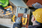 A yellow and black DEWALT cordless impact driver with a 18V motor, a hex-chuck, and variable speed, for high-torque screw driving and fastening.