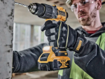 A yellow and black DEWALT cordless combi drill with an 18V motor, a 13mm keyless chuck, and hammer, drill, and screwdriver modes.