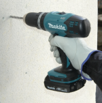 A teal and black Makita cordless combi drill with a 13mm keyless chuck, and hammer, drill, and screwdriver modes.